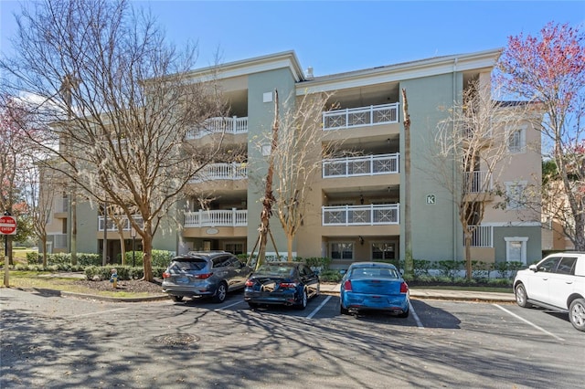 1370 Centre Court Ridge Dr Unit 304, Kissimmee, FL 34747 - view of apartment building / complex with uncovered parking