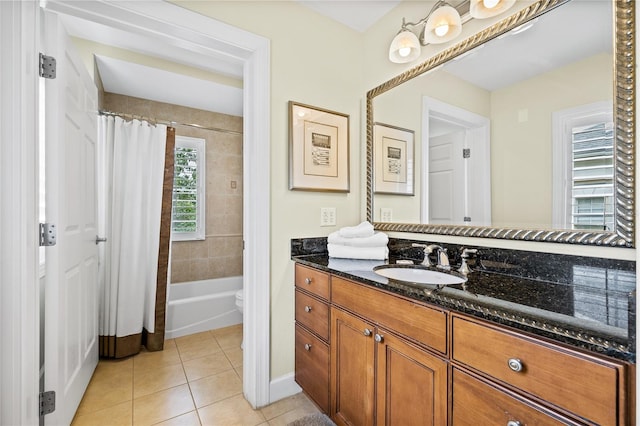 full bathroom featuring tile patterned floors, vanity, toilet, and shower / tub combo with curtain