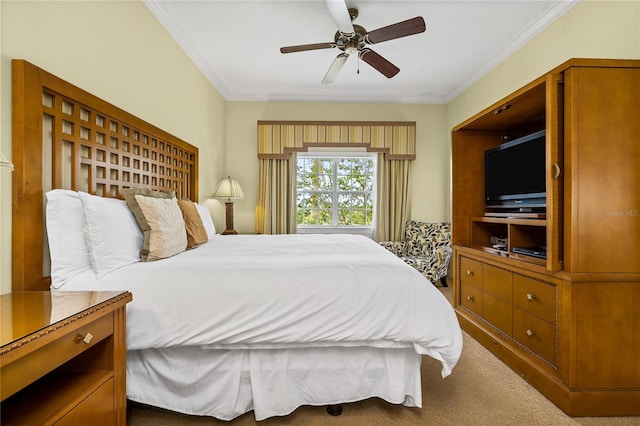 bedroom featuring ceiling fan, carpet floors, and crown molding