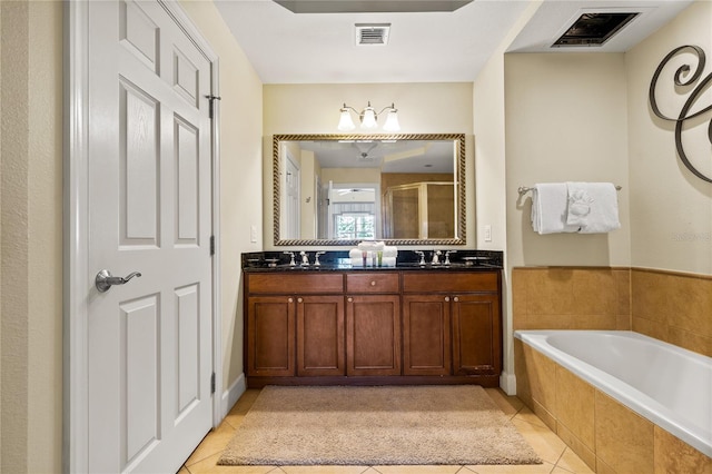 bathroom with tile patterned floors, vanity, and separate shower and tub