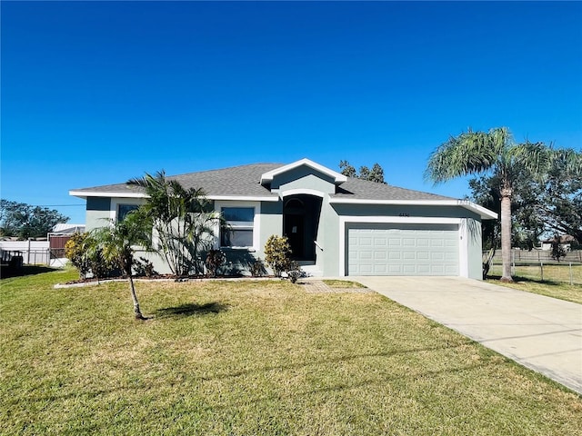 ranch-style house with a front lawn and a garage