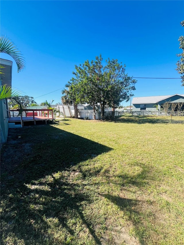 view of yard with a deck