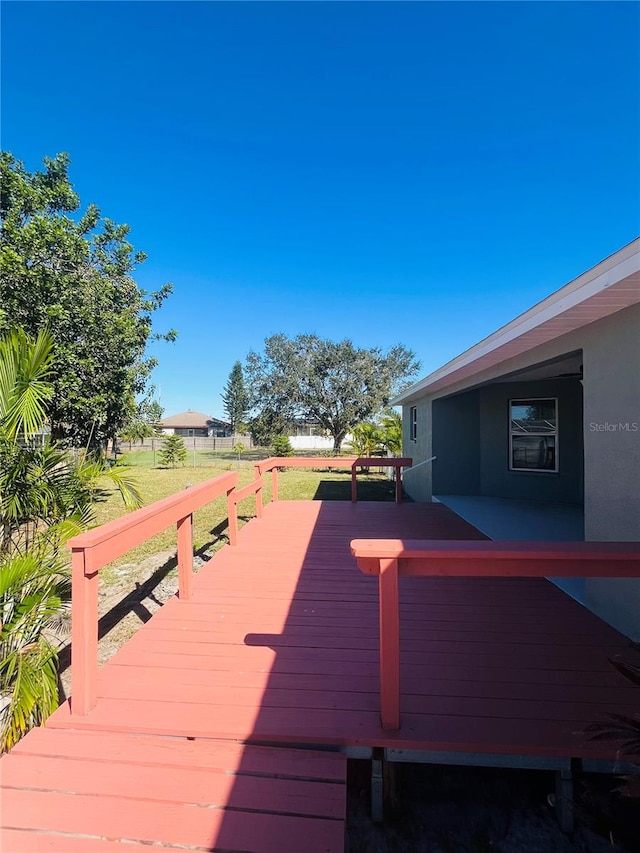 deck featuring a lawn