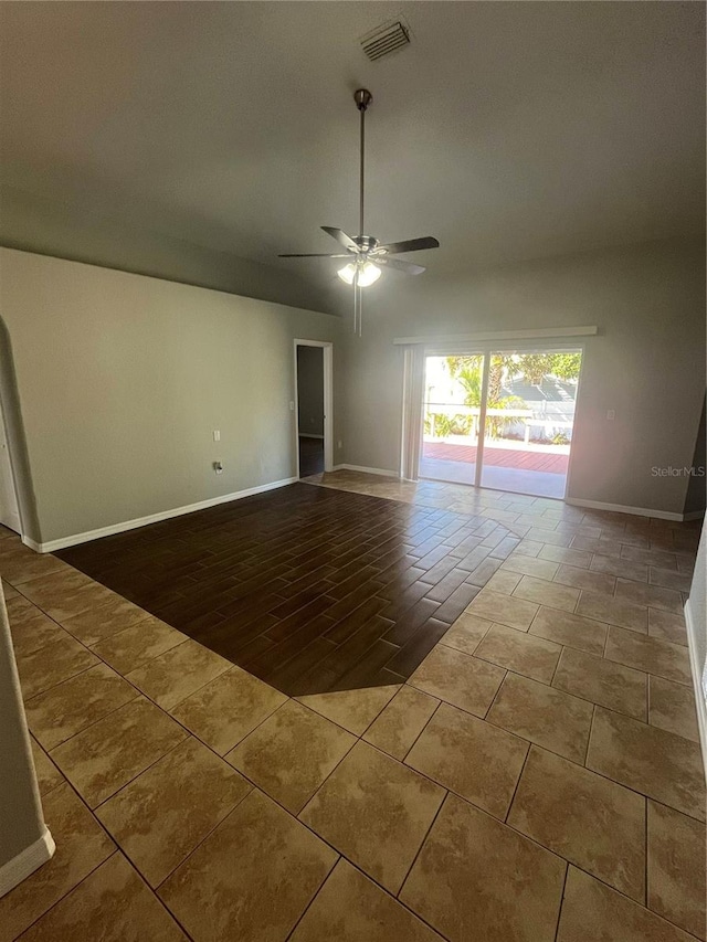 spare room with ceiling fan and wood-type flooring