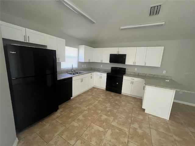 kitchen with light stone countertops, white cabinetry, sink, kitchen peninsula, and black appliances