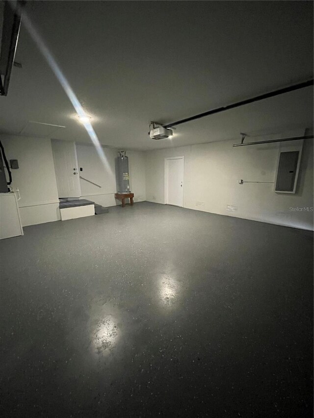 6336 Florida Cir, Apollo Beach, FL 33572 - garage with electric panel, electric water heater, and a garage door opener