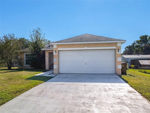 ranch-style house featuring a front lawn and a garage