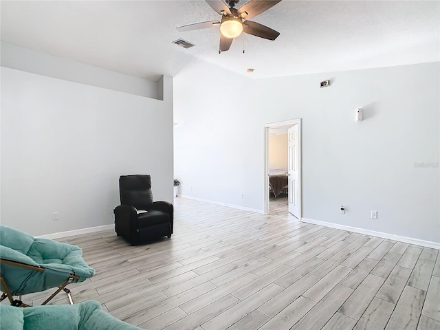 unfurnished room with vaulted ceiling, light hardwood / wood-style flooring, and ceiling fan