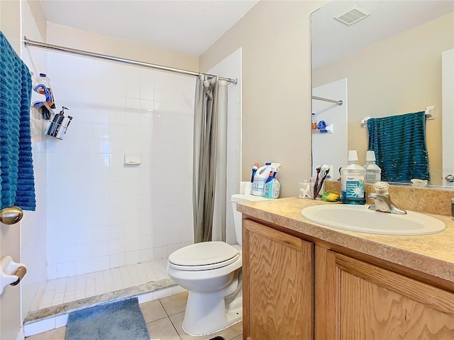 bathroom with tile patterned flooring, vanity, a shower with shower curtain, and toilet