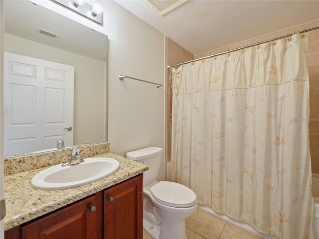 full bathroom with tile patterned floors, a textured ceiling, toilet, shower / tub combo with curtain, and vanity