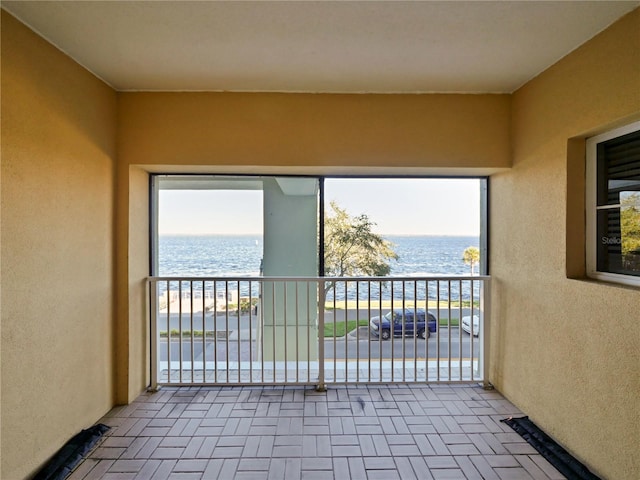 balcony featuring a water view