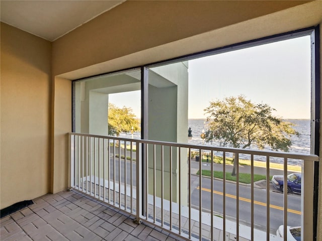 balcony featuring a water view