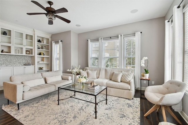 living room with hardwood / wood-style flooring and ceiling fan