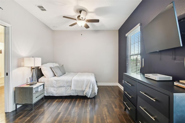 bedroom featuring ceiling fan and dark hardwood / wood-style floors