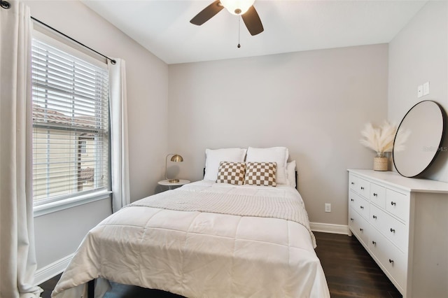 bedroom featuring ceiling fan and dark hardwood / wood-style flooring