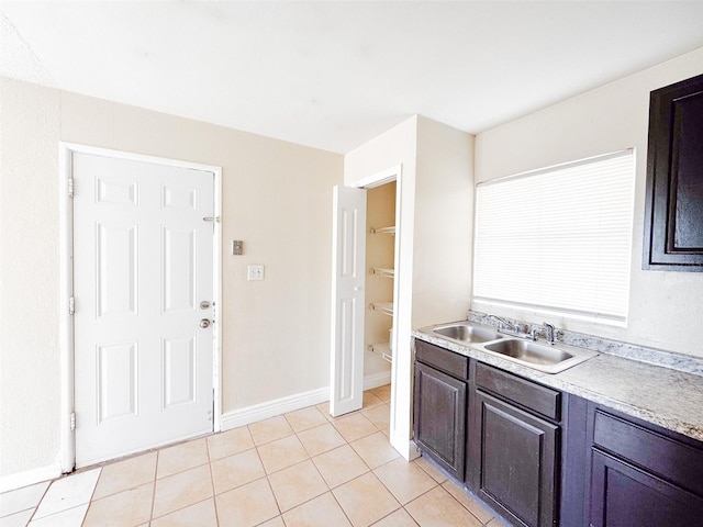 kitchen with sink and light tile patterned floors