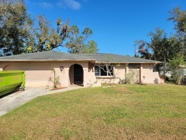 ranch-style house featuring a garage, stucco siding, driveway, and a front yard