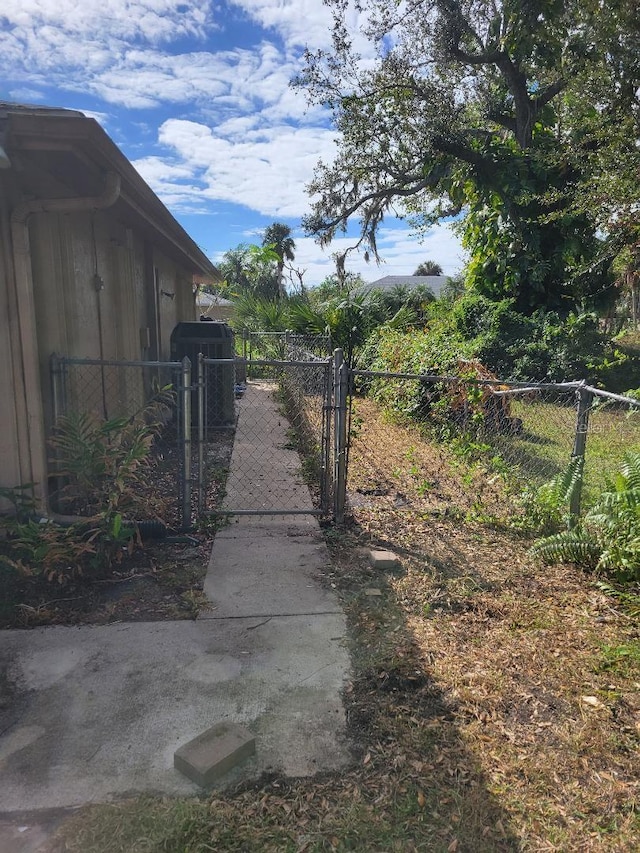 view of yard featuring a gate and fence