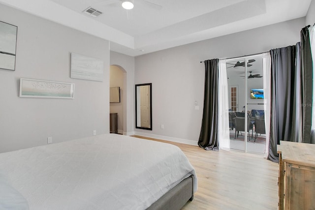 bedroom featuring light wood-type flooring, access to outside, and ceiling fan