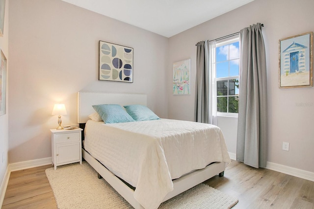 bedroom with light hardwood / wood-style flooring