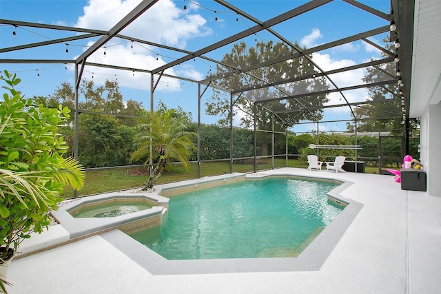 view of pool with an in ground hot tub, a patio, and glass enclosure