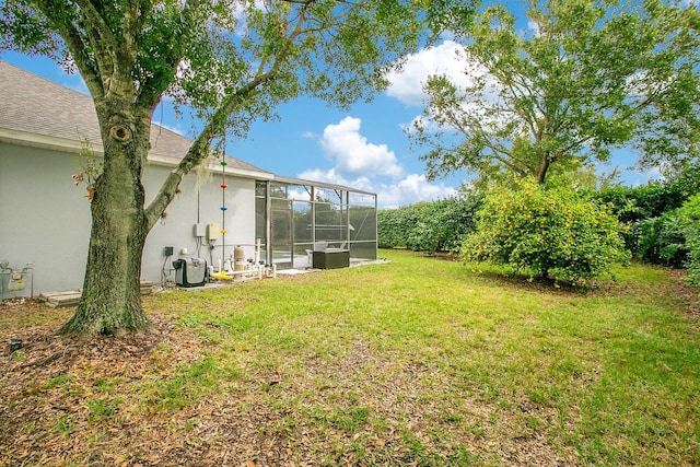 view of yard featuring a lanai