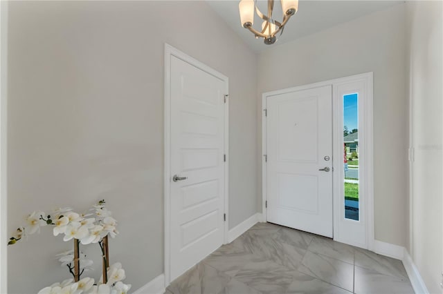 foyer featuring an inviting chandelier