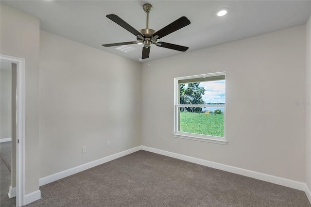 spare room with ceiling fan and carpet floors