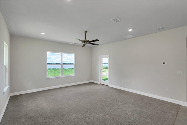 carpeted empty room with ceiling fan