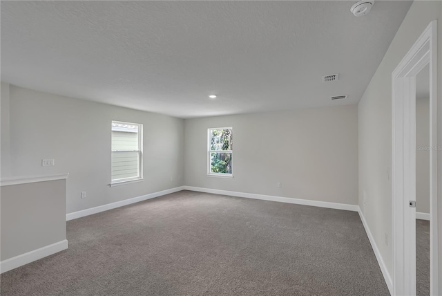 unfurnished room featuring carpet floors