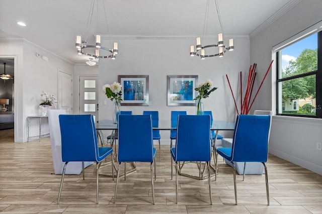 dining area with light wood-type flooring, crown molding, and a notable chandelier