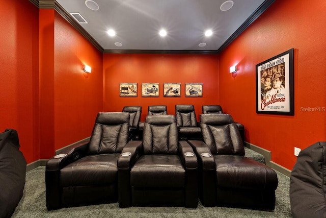 carpeted home theater room with crown molding