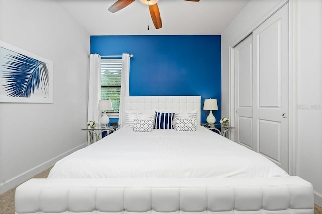 bedroom featuring carpet flooring, ceiling fan, and a closet