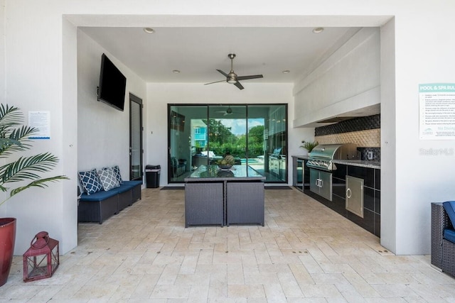 view of patio / terrace featuring an outdoor kitchen, area for grilling, an outdoor living space, and ceiling fan