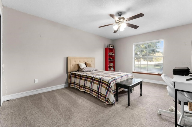 bedroom featuring ceiling fan and carpet