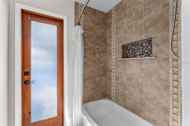 bathroom with shower / bathtub combination with curtain