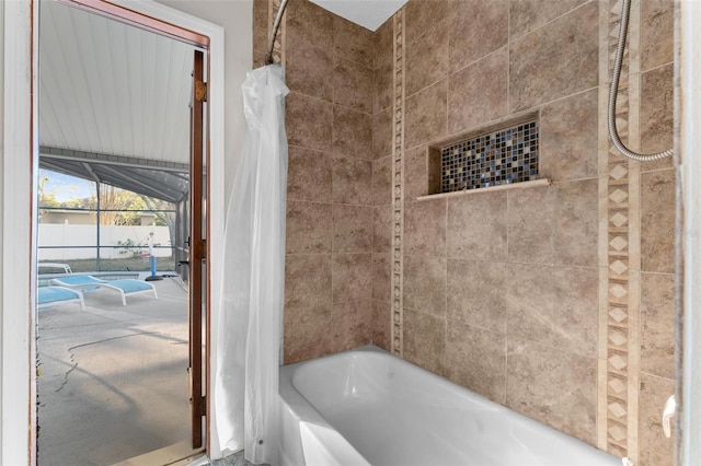 bathroom with shower / bath combo with shower curtain