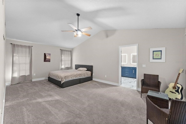 bedroom featuring carpet flooring, ceiling fan, connected bathroom, and vaulted ceiling