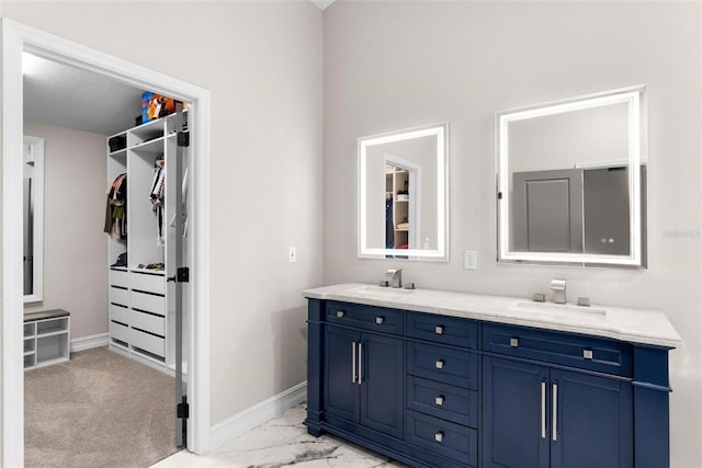 bathroom with vanity and a textured ceiling