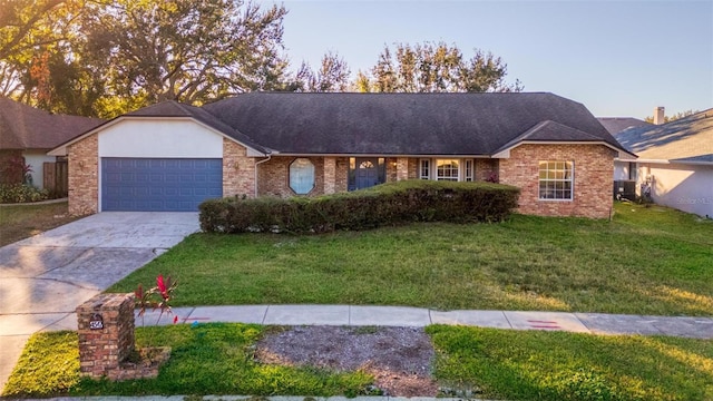 ranch-style house featuring a garage and a front yard