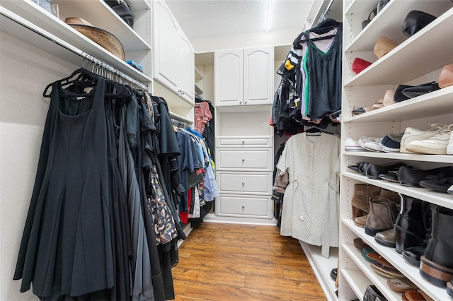 walk in closet featuring light hardwood / wood-style flooring