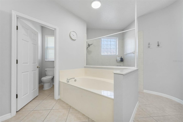 bathroom with tile patterned flooring, a textured ceiling, toilet, and independent shower and bath