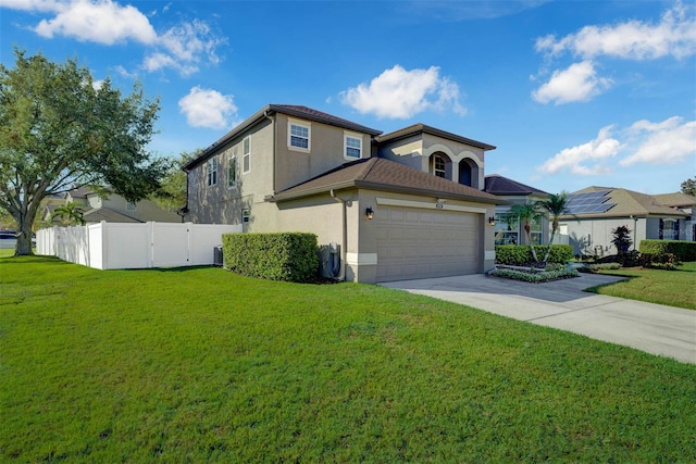 view of front property featuring a front lawn and a garage