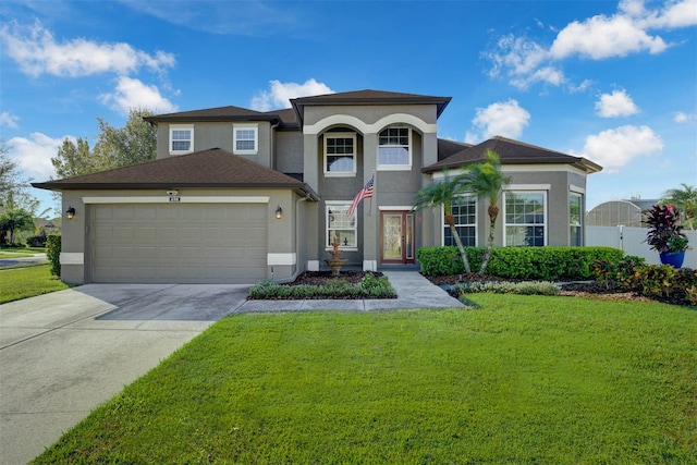 view of front facade with a garage and a front lawn