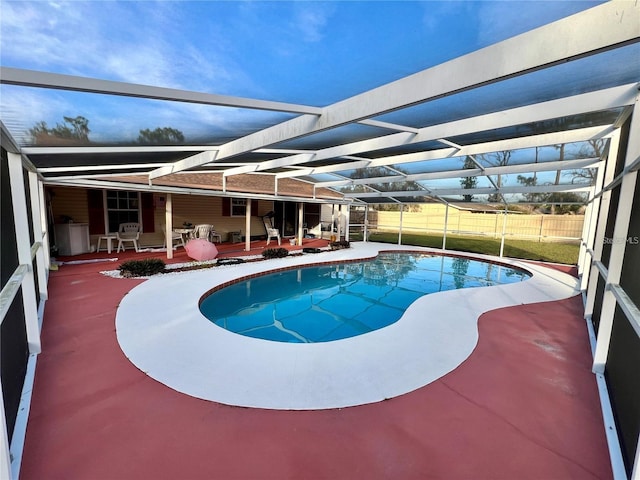 view of pool featuring a lanai, outdoor lounge area, and a patio