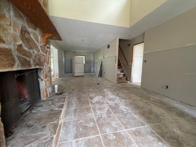 unfurnished living room with a fireplace