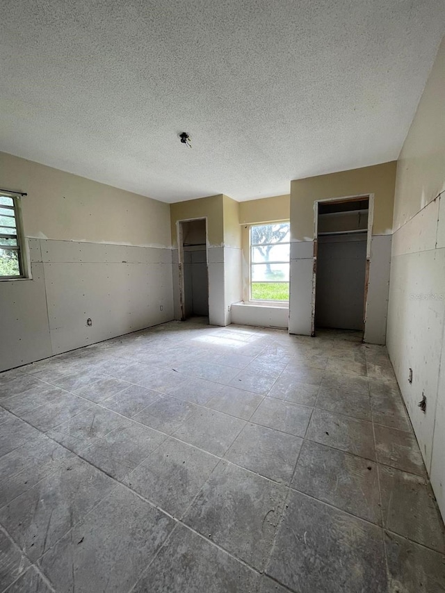 empty room with a textured ceiling