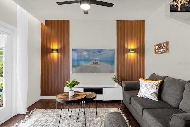 living room with hardwood / wood-style flooring and ceiling fan