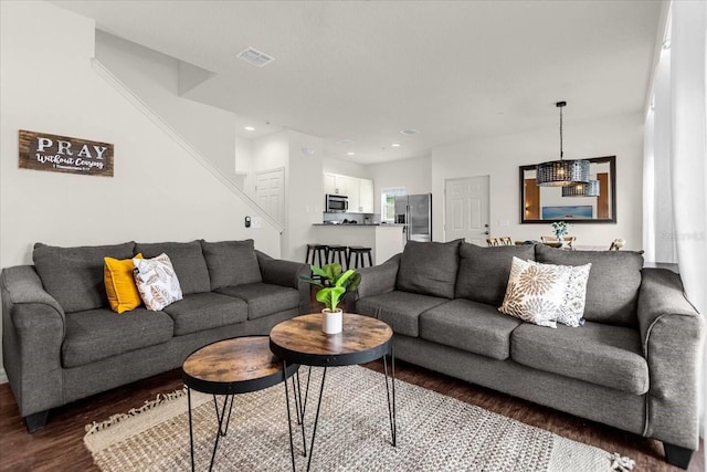 living room featuring dark hardwood / wood-style flooring