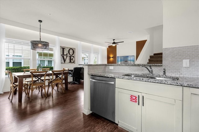 kitchen with dishwasher, decorative light fixtures, plenty of natural light, and sink